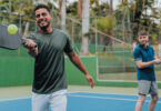 two men playing pickleball