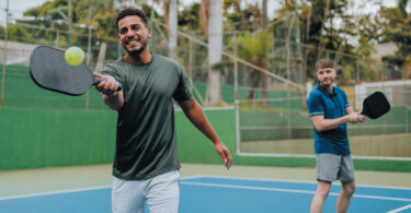 two men playing pickleball